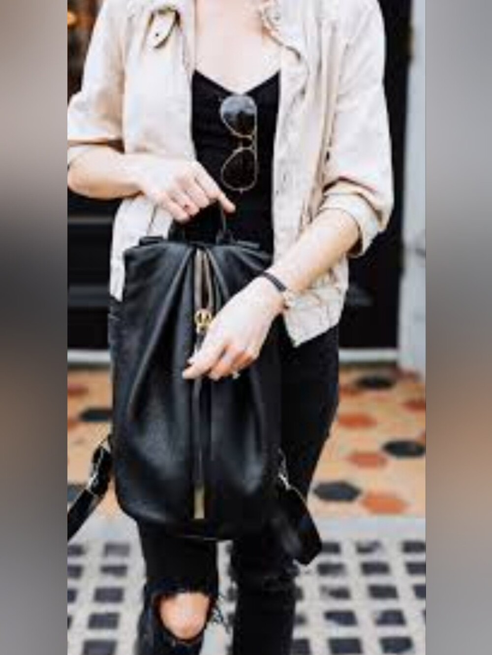 Sleek Black Drawstring Leather Backpack - Modern Women's Bag
